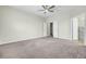 A cozy bedroom features neutral walls, plush carpet, and entry to the bathroom at 9620 Pebble Creek Blvd, Summerville, SC 29485