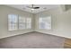 Bright bedroom with large windows and a ceiling fan at 9620 Pebble Creek Blvd, Summerville, SC 29485
