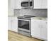 Modern kitchen with stainless steel appliances and white cabinetry at 9620 Pebble Creek Blvd, Summerville, SC 29485
