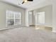 Cozy living room with gray carpet and access to the front door and kitchen at 9620 Pebble Creek Blvd, Summerville, SC 29485