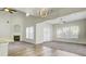 Open living room featuring a fireplace, vaulted ceiling, and abundant natural light at 9620 Pebble Creek Blvd, Summerville, SC 29485