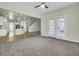 Open living space with kitchen access and a door to outdoor living at 9620 Pebble Creek Blvd, Summerville, SC 29485
