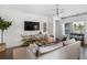 Bright living room featuring a large flatscreen TV, neutral decor, and beautiful views at 103 Pen Shell St, Summerville, SC 29485