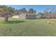 Spacious brick home featuring a lush green lawn with mature trees at 104 Ashdown Dr, Summerville, SC 29483