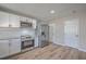 Contemporary kitchen with stainless steel appliances, sleek white cabinets, and ample counter space at 104 Ashdown Dr, Summerville, SC 29483