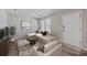 Bright living room featuring a cozy sectional, neutral decor, and natural light from the window at 104 Ashdown Dr, Summerville, SC 29483