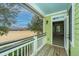 Charming balcony offering views of a grassy field and building; access door to an adjacent room at 1225 Blakeway St # 406, Charleston, SC 29492