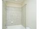Tiled bath and shower combination with tub in a bright, neutral colored bathroom at 1225 Blakeway St # 406, Charleston, SC 29492