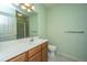Bathroom features a single sink vanity with wood cabinets and a shower with glass door at 1225 Blakeway St # 406, Charleston, SC 29492