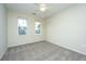 Sun-filled bedroom with neutral paint, carpet flooring, and a ceiling fan with light at 1225 Blakeway St # 406, Charleston, SC 29492