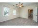 Cozy bedroom with new carpet, neutral paint, a ceiling fan, and windows for ample natural light at 1225 Blakeway St # 406, Charleston, SC 29492
