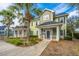 Charming two-story townhouse with palm trees, manicured lawn, and inviting entryway with an American flag at 1225 Blakeway St # 406, Charleston, SC 29492