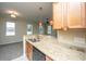 Gourmet kitchen featuring granite counters, a stainless steel dishwasher, and pendant lighting at 1225 Blakeway St # 406, Charleston, SC 29492