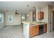 Modern kitchen featuring granite countertops, stainless steel appliances, and an open view to a living space at 1225 Blakeway St # 406, Charleston, SC 29492