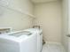 The laundry room features a white washer and dryer plus a wire rack at 1225 Blakeway St # 406, Charleston, SC 29492