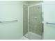 Bathroom featuring tiled shower with glass doors and chrome hardware, offering a clean design at 1225 Blakeway St # 406, Charleston, SC 29492