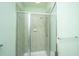 Bathroom featuring tiled shower with glass doors and chrome hardware, offering a clean design at 1225 Blakeway St # 406, Charleston, SC 29492