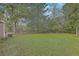 Spacious backyard with lush green grass and mature trees, offering privacy and room for outdoor activities at 1228 Hawthorne Rd, Hanahan, SC 29410