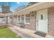 Charming brick home featuring a cozy front porch with bench seating and well-maintained exterior at 1228 Hawthorne Rd, Hanahan, SC 29410