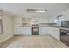 Bright kitchen featuring white cabinets, modern appliances, and ample counter space at 1228 Hawthorne Rd, Hanahan, SC 29410
