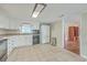 Kitchen area with white cabinets, tiled floor, and modern appliances at 1228 Hawthorne Rd, Hanahan, SC 29410