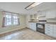 Bright eat-in kitchen featuring white cabinets, tile floors, and lots of natural light at 1228 Hawthorne Rd, Hanahan, SC 29410