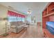 Comfortable living room with hardwood floors, a cozy sofa, and ample natural light at 1228 Hawthorne Rd, Hanahan, SC 29410