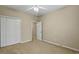 Bedroom featuring neutral walls, carpet floors, a closet and a door at 1354 Old Ivy Way, Mount Pleasant, SC 29466