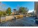 Backyard deck features a patio heater, seating, and views of the landscaped yard, perfect for outdoor enjoyment at 1401 Cooper River Blvd, Moncks Corner, SC 29461