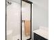 Modern bathroom shower with a black frame, glass doors, and sleek fixtures, providing a clean and stylish design at 1401 Cooper River Blvd, Moncks Corner, SC 29461