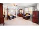 Spacious bedroom with natural light, including a canopy bed, and a leather chair at 1401 Cooper River Blvd, Moncks Corner, SC 29461