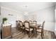 Formal dining room with stylish decor, wainscoting and a large table perfect for entertaining guests at 1401 Cooper River Blvd, Moncks Corner, SC 29461