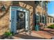 Inviting front porch with a welcoming welcome sign, stylish door decorations, and charming brick accents at 1401 Cooper River Blvd, Moncks Corner, SC 29461
