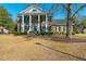 Stately two-story brick home with prominent white columns and a beautifully manicured front lawn at 1401 Cooper River Blvd, Moncks Corner, SC 29461