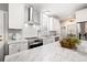 Bright kitchen featuring stainless steel appliances, white cabinetry, and marble countertops for a modern look at 1401 Cooper River Blvd, Moncks Corner, SC 29461