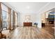 Spacious living room with hardwood floors, a cozy fireplace, and large windows offers ample natural light at 1401 Cooper River Blvd, Moncks Corner, SC 29461