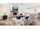 Cozy living room featuring a brick fireplace and comfortable seating area with a large TV at 1401 Cooper River Blvd, Moncks Corner, SC 29461