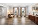 Elegant living room featuring wood floors, neutral walls, large windows, and classic furnishings at 1401 Cooper River Blvd, Moncks Corner, SC 29461