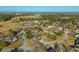 Aerial view of a quiet residential neighborhood, featuring diverse home styles and mature trees at 1401 Cooper River Blvd, Moncks Corner, SC 29461
