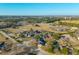 Aerial view of a community featuring residential homes, open fields, and light commercial areas at 1401 Cooper River Blvd, Moncks Corner, SC 29461