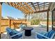 Relaxing backyard patio area with wood pergola and plenty of seating at 146 Stagecoach Ave, Summerville, SC 29486
