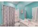 Bright bathroom with a shower and tub, a sink with a mirror, and a blue-painted wall at 146 Stagecoach Ave, Summerville, SC 29486