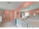 Well-lit bathroom featuring double sinks, decorative accents, and a separate tub and shower at 146 Stagecoach Ave, Summerville, SC 29486