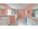 Bright bathroom with white cabinets, double sinks, and a separate tub and shower at 146 Stagecoach Ave, Summerville, SC 29486