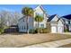 Two story home with a two-car garage, a well-manicured lawn and beautiful landscaping at 146 Stagecoach Ave, Summerville, SC 29486