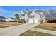 Charming two-story home with a well-manicured lawn, a two-car garage, and a welcoming facade at 146 Stagecoach Ave, Summerville, SC 29486