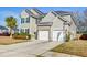 Beautiful home with a brick and siding facade, a two-car garage, and a well-kept lawn at 146 Stagecoach Ave, Summerville, SC 29486