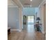 Inviting foyer showcasing wood floors, vintage sewing table, and a classic grandfather clock at 146 Stagecoach Ave, Summerville, SC 29486