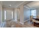 Spacious foyer featuring hardwood floors, a dining table, and a view into adjacent living spaces at 146 Stagecoach Ave, Summerville, SC 29486
