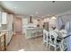 Modern kitchen with white cabinets, stainless steel appliances, and an adjacent dining area at 146 Stagecoach Ave, Summerville, SC 29486